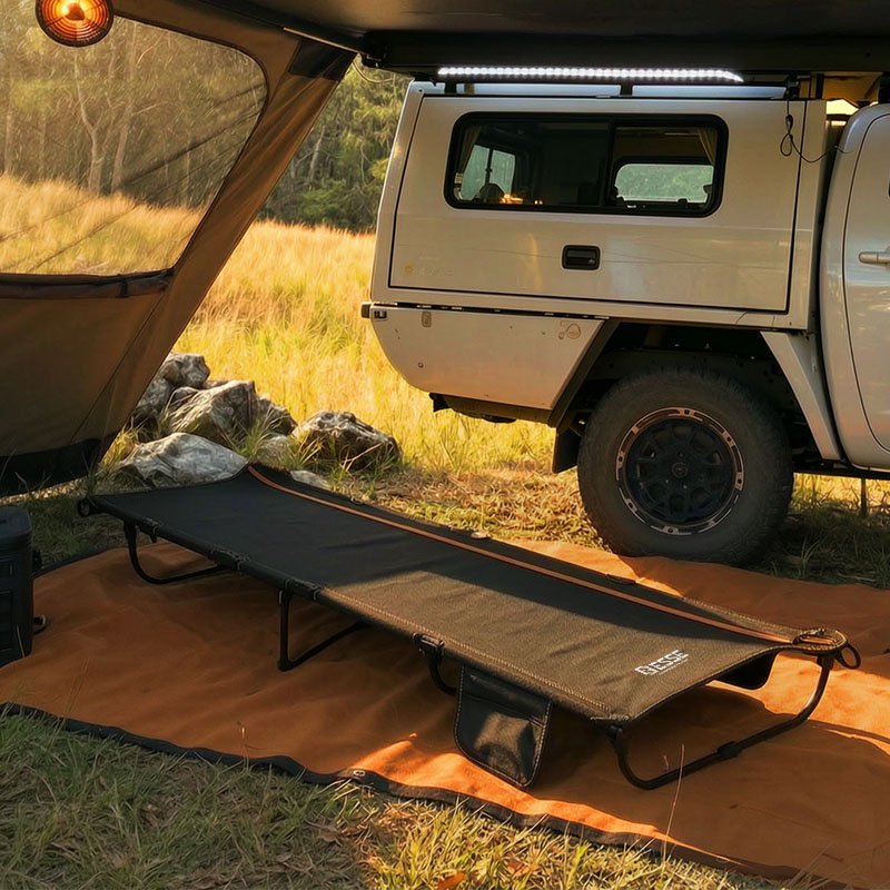 Folding camp bed with canvas deck and aluminium frame